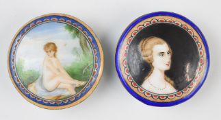 Two enamelled pill boxes, one depicting a nude lady, diameter 6cm