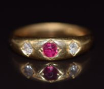 A c1900 18ct gold ring set with a ruby and diamonds, 4.3g, size K