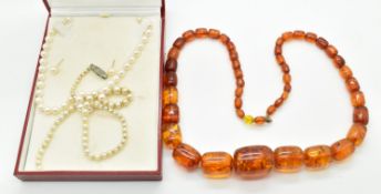 A single strand of cultured pearls with 9ct gold bi-coloured clasp, a pair of pearl earrings, a