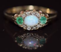 A 9ct gold ring set with an opal, emeralds and diamonds, 2.2g, size M