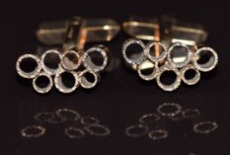 A pair of 9ct gold cufflinks made up of textured circular links, in original Asprey box, 10.4g