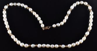 A single strand of freshwater pearls interspersed with 9ct gold beads, with 9ct gold clasp