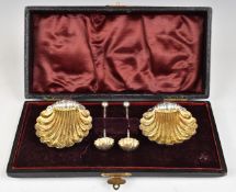 Victorian cased pair of hallmarked silver salts formed as shells, with matching spoons, Birmingham