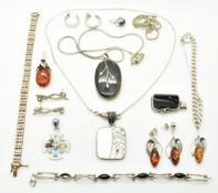 A collection of silver jewellery including tennis bracelet, silver curb link bracelet, a pair of