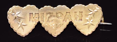 A 9ct gold Mizpah brooch in the form of three hearts, 1.8g