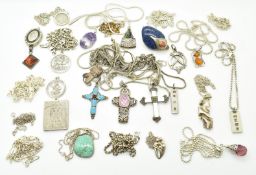 Twenty four silver necklaces/ chains including lapis lazuli, pressed amber, St Christophers, ingots,