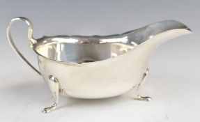 Elizabeth II hallmarked silver sauce boat raised on three feet, Birmingham 1990, maker Barker