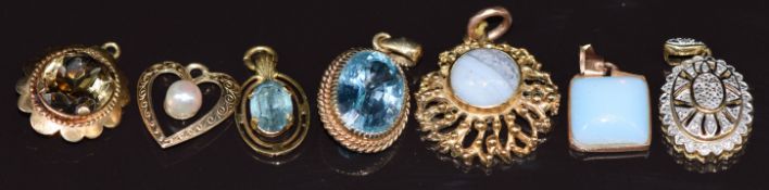 Seven 9ct gold pendants variously set with topaz, quartz, diamonds, agate, pearl, and paste, 14.3g