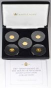 Jubilee Mint 100th Anniversary of the House of Windsor 9ct gold coin set comprising five 16mm coins,