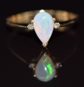 A 14k gold ring set with a pear cut opal cabochon and diamonds,1.5g, size N