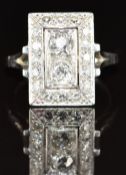Art Deco platinum ring set with old cut diamonds, the central two diamonds approximately 0.3ct