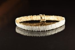 A 9ct gold bracelet set with three rows of diamonds, totalling approximately 1.3ct, 19g