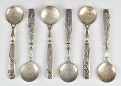 Set of six German silver dessert or similar spoons with naturalistic handles and engraved bowls,