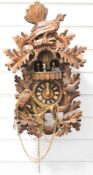Cuckoo clock with rotating figures, height 49cm