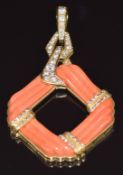 An 18k gold bespoke pendant set with carved coral and diamonds, the largest diamond approximately