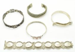 Four silver bangles / bracelets including rose quartz