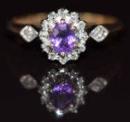 A 9ct gold ring set with an amethyst and diamonds, 1.9g, size N