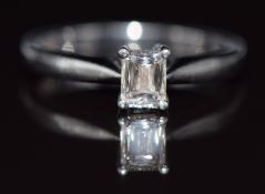 An 18ct white gold ring set with a 0.31ct diamond surrounded by further diamonds, with Tolkowsky