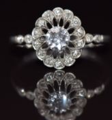 Art Deco platinum ring set with diamonds in a pierced setting, the centre diamond approximately 0.