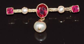 An 18ct gold brooch set with three synthetic rubies, two split pearls and a drop pearl, 5.7g