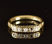 A 9ct gold ring set with diamonds (one missing), 1.4g, size J