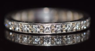 Art Deco platinum eternity ring set with twenty two round cut diamonds, each approximately 0.03ct,