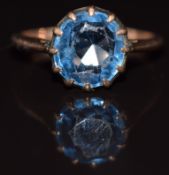 A 9ct gold ring set with a round cut topaz, 2.7g, size O