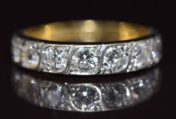 An 18ct gold half eternity ring set with seven diamonds, each approximately 0.13ct, 3.1g, size M