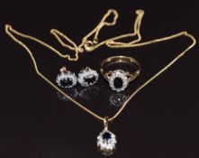 A suite of 9ct gold jewellery set with sapphires and diamonds comprising ring, necklace and
