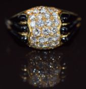 An 18k gold ring set with round cut diamonds and onyx, 10.6g, size L