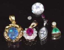 An 18ct gold pendant set with an opal and diamonds (2.4g), two 9ct gold pendants one set with a ruby
