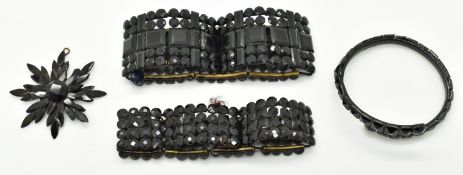 A collection of French jet comprising two 19thC bracelets, bangle and pendant