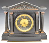 Black slate or marble cased French mantel clock with part gilt dial with pediment above and