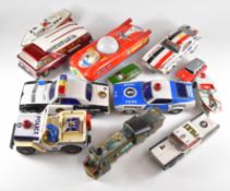 A collection of Japanese and similar style tin plate vehicles.