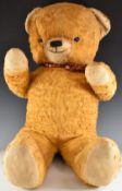 Merrythought Cheeky style teddy bear with golden mohair, shaved snout and jointed limbs, 95cm tall.