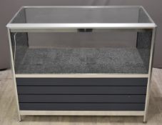 Aluminium framed shop display counter or display cabinet with cubby hole below, W120 x D60 x H95cm