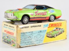 T.P.S Japan 'The Swinger' battery operated tinplate car in original box.