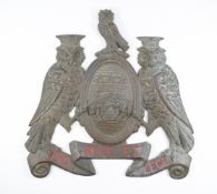 Leeds interest bronze wall plaque formed as the coat of arms of Leeds flanked by owls, width 25cm