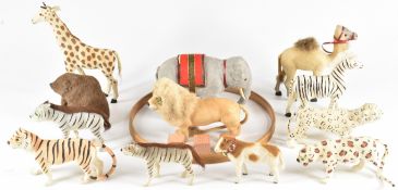 Twelve model zoo or circus animals, all made with real leather and fur, largest 14cm tall.