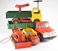 Four larger scale tinplate vehicles to include Tri-Ang Ride On Tipper Truck