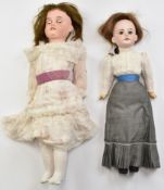 Two bisque headed dolls comprising one Gebruder Kuhnlenz with weighted brown eyes, open mouth, brown