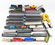 00 gauge model railway rolling stock comprising coaches, wagons and an LNER locomotive tender,