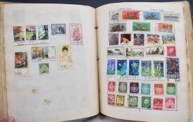 An accumulation of GB and world stamps in various albums and loose including Isle of Man
