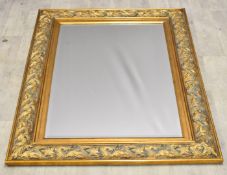 Gilt framed mirror with bevelled glass plate and basket weave style frame, overall size 89 x 119cm