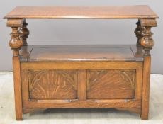 Oak monk's bench with carved decoration, length 106cm