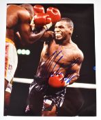 Mike Tyson 25 x 20cm autographed photo signed in blue ink to the centre right.