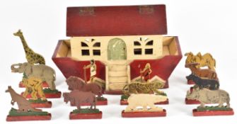 A wooden model of an ark (25x19x13cm) with free standing cut and hand painted wooden animals and