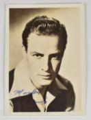 Marlon Brando autographed 18 x 13cm photo, signed bottom left in blue ink.