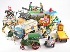 A collection of loose and boxed Japanese and simlar style tinplate vehicles.