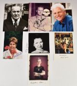 Seven autographed publicity photos and postcards signed by novelists comprising Alan Bennett, P.D.